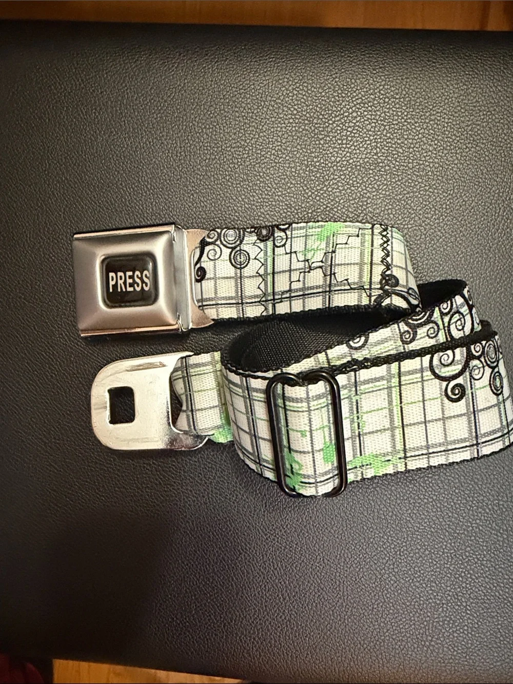 Buckle-Down White & Green Plaid Seatbelt belt with Black Swirl Accents